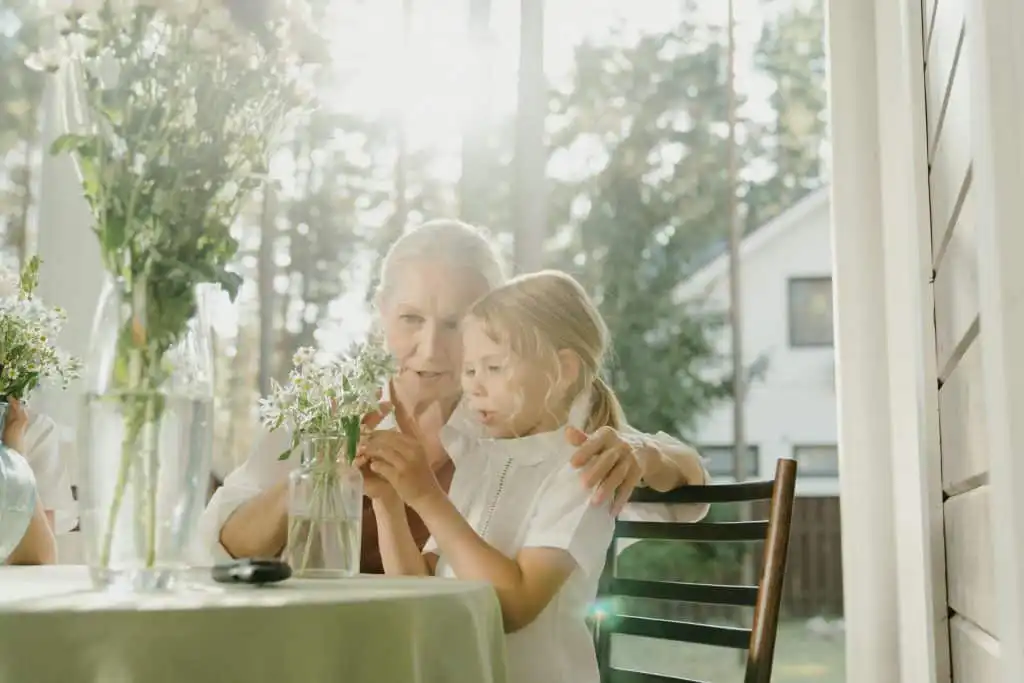 Grandmother and granddaughter enjoying comfortable home environment
