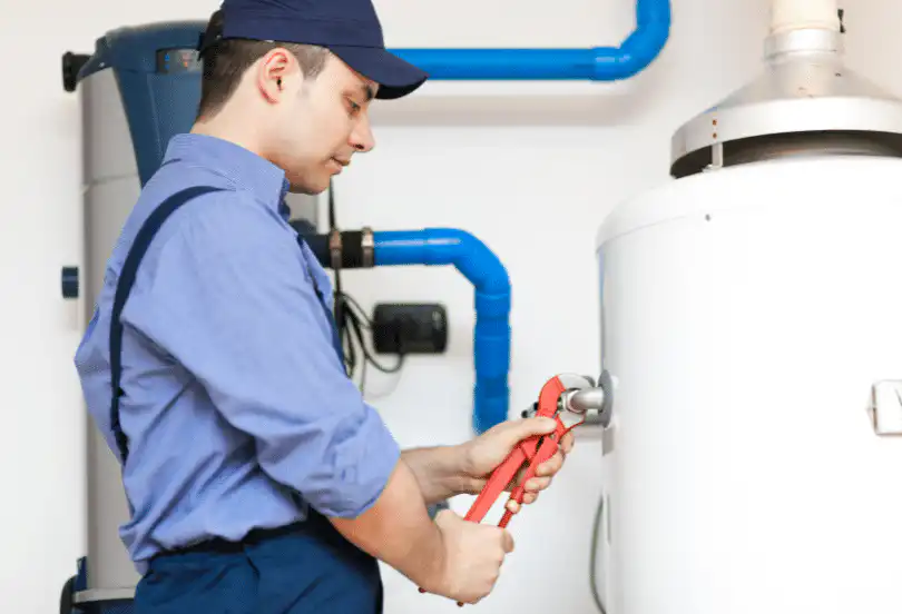 technician repairing an hot water heater